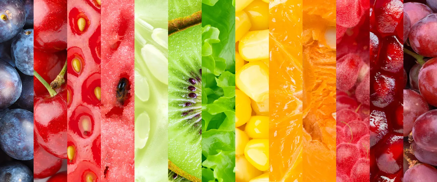 Sliced fruit and vegetables arranged as vertical colour strips